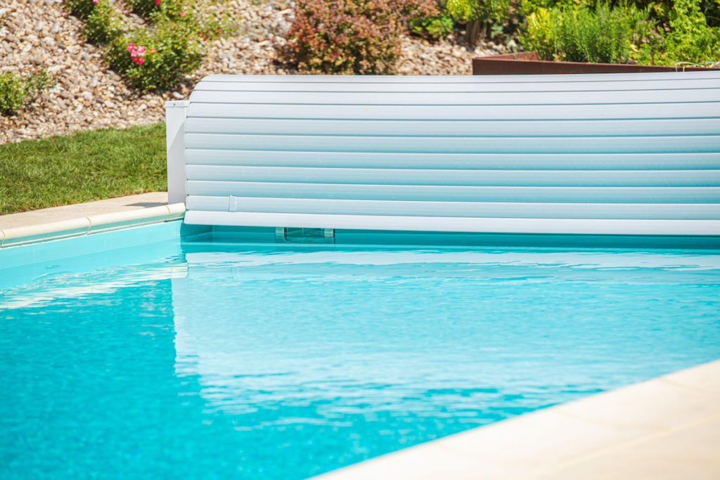 swimming pool with a retractable cover